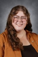 Picture of a person with a brown jacket