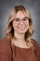 Picture of a person wearing a brown sweater