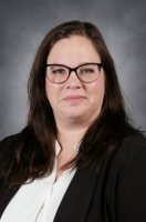 Picture of a person in a white and black shirt