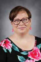 Picture of a woman in a black flower shirt
